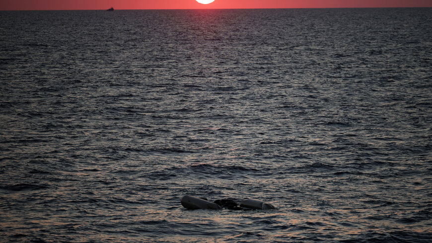 FILE PHOTO: A rubber boat used by migrants floats at the sea on sunset in the Mediterranean, off Libya, August 9, 2025. REUTERS/Louisa Gouliamaki/File Photo
