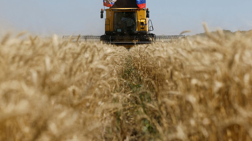 FILE PHOTO: A farmer operates a combine during the start of the wheat harvesting campaign in a field near the town of Starobilsk (Starobelsk) in the Luhansk Region, a Russian-controlled area of Ukraine, July 9, 2025. REUTERS/Alexander Ermochenko/File Photo