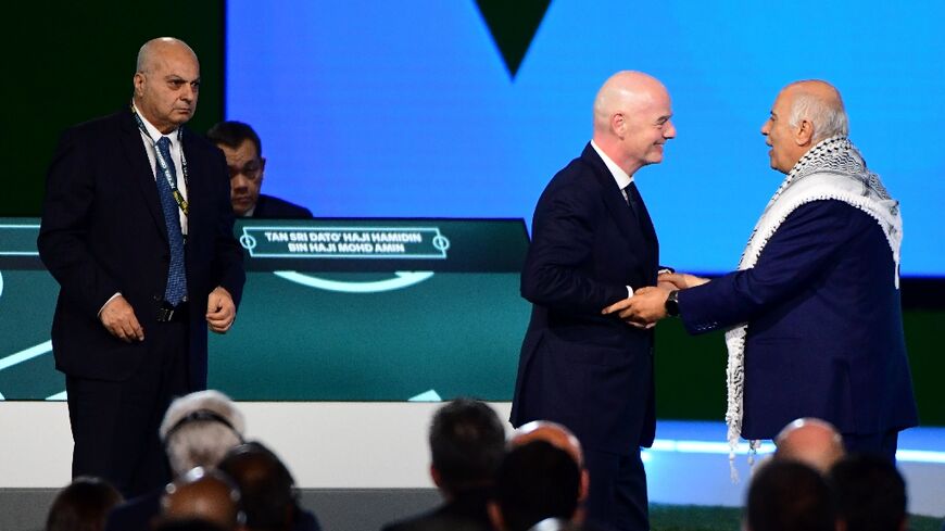 FIFA President Gianni Infantino invited President of the Palestine Football Association Jibril Rajoub and Vice-President of Israel Football Association Basim Sheikh Suliman to stand alongside him, but Rajoub declined