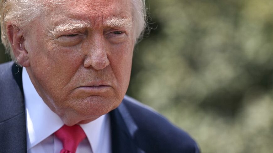 US President Donald Trump speaks to reporters before walking to board Marine One as he departs from the South Lawn of the White House in Washington