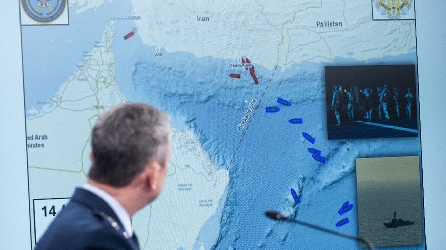 US Chairman of the Joint Chiefs of Staff General Dan Caine shows a map of the Strait of Hormuz at a Pentagon press briefing