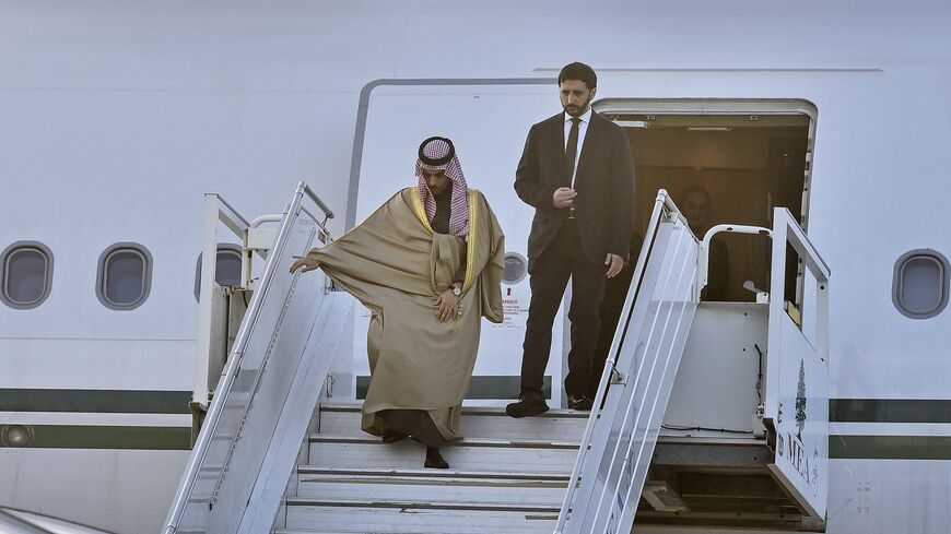 Saudi Arabia's Foreign Minister Faisal bin Farhan (L) disembarks from an airplane upon his arrival at the Rafic Hariri International Airport in Beirut on Jan. 23, 2025. 