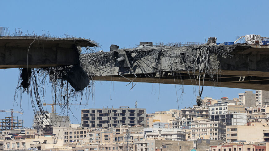 TOPSHOT - A view of the B1 bridge is pictured, a day after it was destroyed by a strike in Karaj, around 20miles (35kms) southwest of Tehran, April 3, 2026. US President Donald Trump said on April 2 the tallest bridge in Iran had been destroyed, hours after threatening to bomb the country "back to the Stone Ages." (Photo by ATTA KENARE / AFP via Getty Images) /
