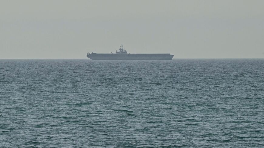 A ship is seen off the coast of Ras al-Khaimah, the day after the failure of US-Iran peace talks on April 13, 2026. The failure of US-Iran peace talks has left the US president with several unpalatable options, as analysts say his order to blockade the strategic Strait of Hormuz could further complicate his next move on April 12, 2026. Any hopes that the US vice president would emerge from the marathon day of negotiations with top Iranian officials with a deal to end a war that has rippled across the Middle