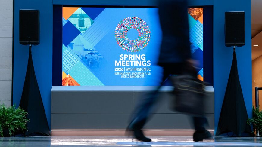 A man walks through the atrium during the 2026 IMF and World Bank Group Spring Meetings in Washington, DC, on April 14, 2026. (Photo by Kent NISHIMURA / AFP via Getty Images)