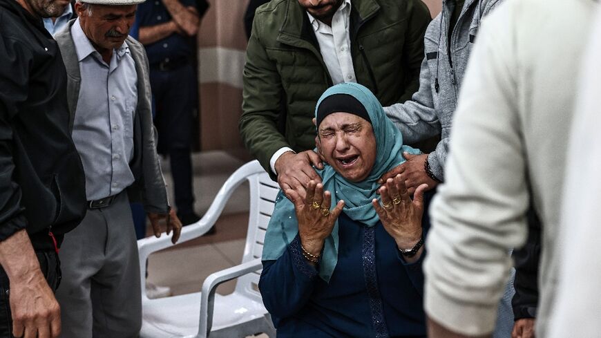 Distraught relatives crowded around the bodies draped in Palestinian flags