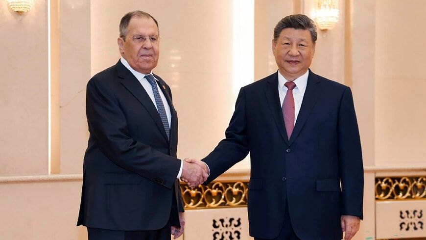 Russian Foreign Minister Sergei Lavrov (L) said Moscow could help China with energy supplies following the blockade of the Strait of Hormuz