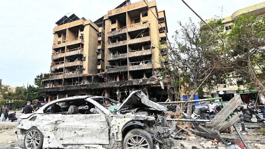 Blackened buildings and burned-out cars... scenes from Beirut's southern suburbs