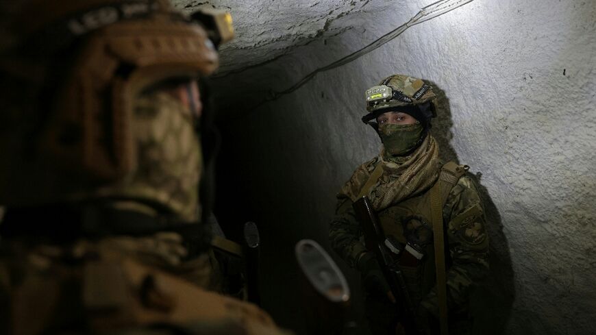 Syrian soldiers inspect a tunnel on the Lebanon border in the Qusayr area