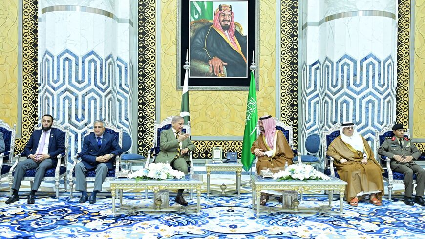 Prime Minister Muhammad Shehbaz Sharif (L) arrives in Jeddah for an official visit to Saudi Arabia, where he is warmly welcomed at the airport by Prince Saud bin Mashaal bin Abdulaziz, on April 15, 202