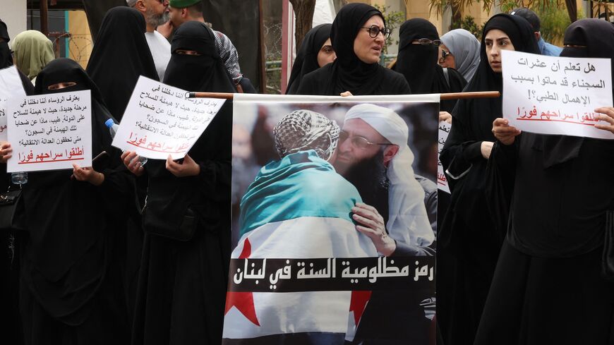 Women hold portraits of jailed Islamist cleric Sheikh Ahmad al-Assir during a protest calling for his release in Beirut on April 24, 2025.