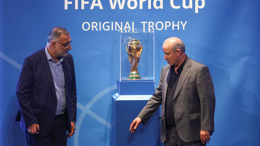 FILE PHOTO: President of Iran Football Federation Mehdi Taj and Mayor of Tehran Alireza Zakani stand next to the FIFA World Cup Trophy during an unveiling ceremony in Tehran, Iran September 1, 2022.  Majid Asgaripour/WANA (West Asia News Agency) via REUTERS/ File Photo