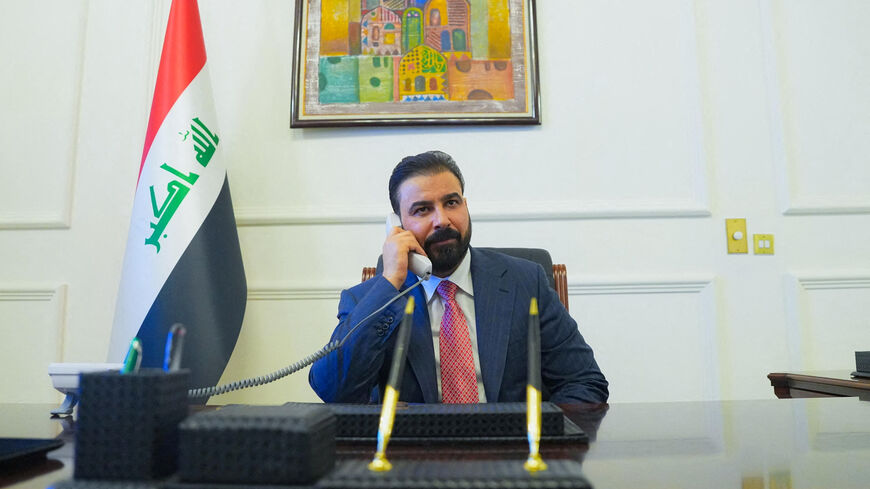 FILE PHOTO: New Iraqi Prime Minister designate Ali al-Zaidi, uses a phone at his office in Baghdad, Iraq, April 28, 2026. Iraqi Prime Minister’s Media Office/Handout via REUTERS/File Photo
