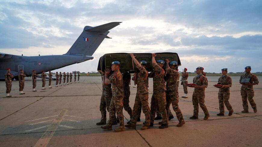 Members of the French military carry the coffin of Sergeant-Chef Florian Montorio, who was killed while clearing a road in southern Lebanon in an attack that UNIFIL peacekeepers and French officials said was likely carried out by Hezbollah, at Beirut-Rafic Hariri International Airport in Beirut, Lebanon, April 19, 2026. Haidar Fahs/UNIFIL/Handout via REUTERS