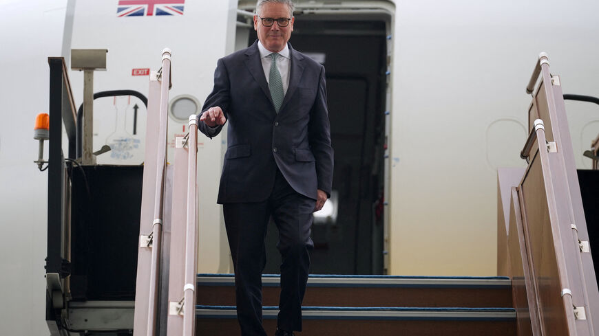 Britain's Prime Minister Keir Starmer deboards the airplane as he arrives at the airport in Abu Dhabi, United Arab Emirates, Thursday, April 9, 2026.    Alastair Grant/Pool via REUTERS