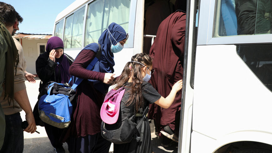 Members of Australian families believed to be linked to the Islamic State militants leave Roj camp near Derik, Syria April 24, 2026. REUTERS/Orhan Qereman