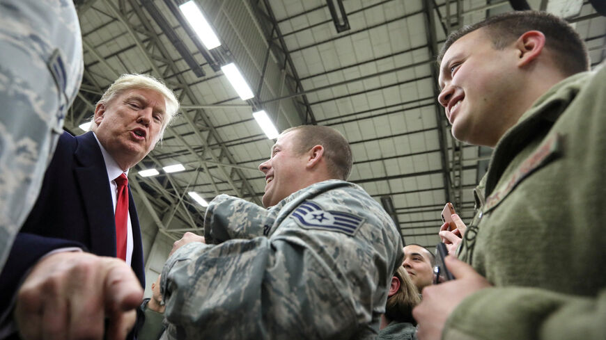 FILE PHOTO: U.S. President Donald Trump gestures as he visits U.S. troops at Ramstein Air Force Base, Germany, December 27, 2018. REUTERS/Jonathan Ernst/File Photo