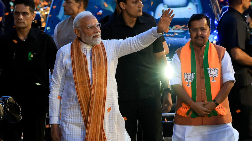 India's Prime Minister Narendra Modi greets his supporters as he arrives at the Bharatiya Janata Party (BJP) headquarters in New Delhi, India, May 4, 2026. REUTERS/Adnan Abidi/File Photo