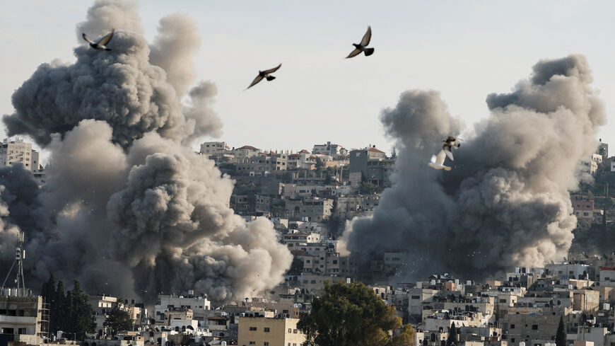 Birds fly as smoke rises during an Israeli army operation in Jenin, in the Israeli-occupied West Bank, February 2, 2025. REUTERS/Raneen Sawafta/File Photo