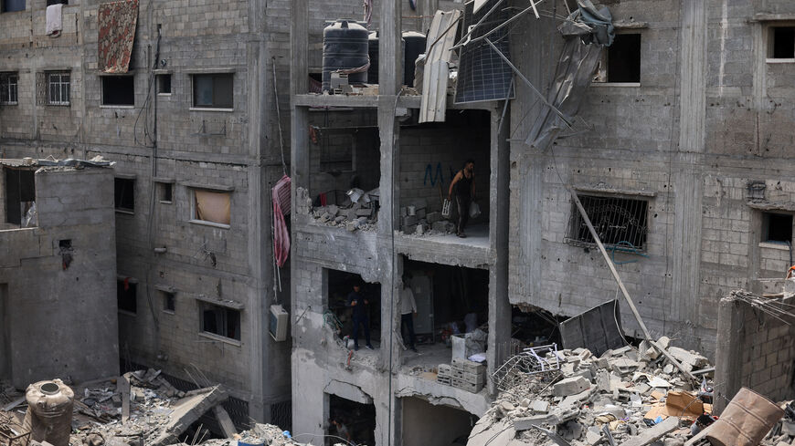 Palestinians inspect the site of a Friday Israeli air strike on houses, at Shati (Beach) refugee camp in Gaza City, May 9, 2026. REUTERS/Dawoud Abu Alkas