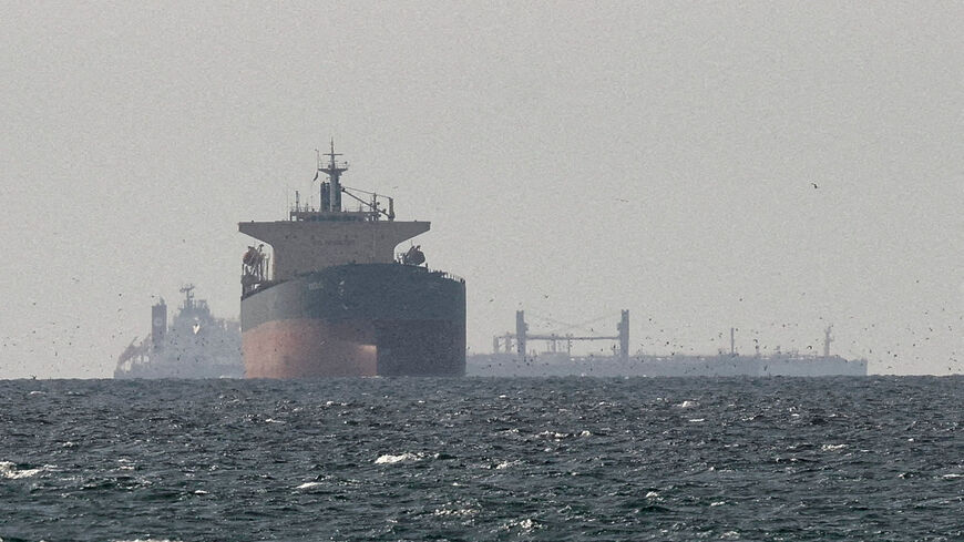FILE PHOTO: Cargo ships in the Gulf, near the Strait of Hormuz, as seen from northern Ras al-Khaimah, near the border with Oman’s Musandam governance, amid the U.S.-Israeli conflict with Iran, in United Arab Emirates, March 11, 2026./File Photo