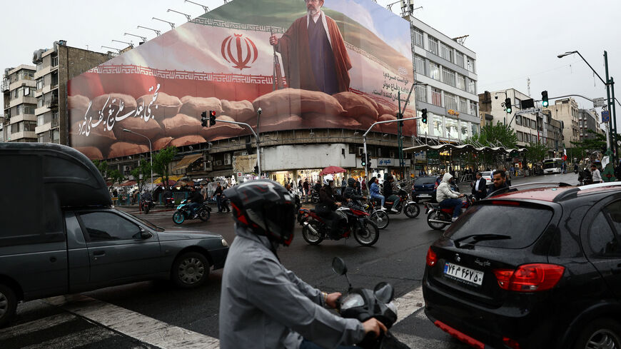 People ride motorcycles near a billboard featuring an image of Iran's new Supreme Leader Mojtaba Khamenei, amid a ceasefire between U.S. and Iran, in Tehran, Iran, April 20, 2026. Majid Asgaripour/WANA (West Asia News Agency) via REUTERS