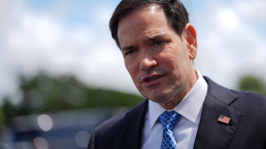 Secretary of State Marco Rubio speaks to the press before boarding his plane at Homestead Air Reserve Base, Thursday, May 21, 2026.  Rubio is traveling to a NATO foreign ministers meeting in Sweden.      Julia Demaree Nikhinson/Pool via REUTERS