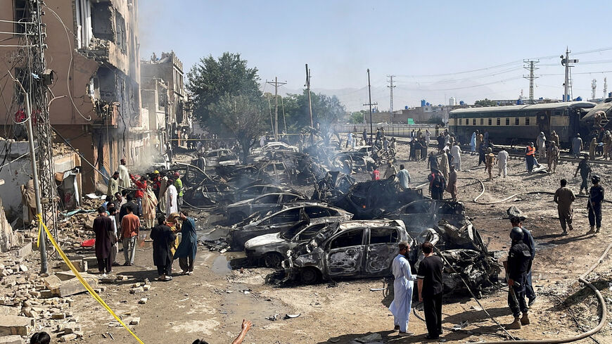 People and police officers gather after a blast near a railway track in Quetta, Pakistan, May 24, 2026. Picture taken with a mobile phone. REUTERS/Stringer     TPX IMAGES OF THE DAY