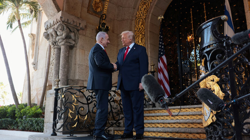 FILE PHOTO: U.S. President Donald Trump greets Israeli Prime Minister Benjamin Netanyahu upon arrival for meetings at Trump's Mar-a-Lago club in Palm Beach, Florida, U.S., December 29, 2025. REUTERS/Jonathan Ernst/ File Photo