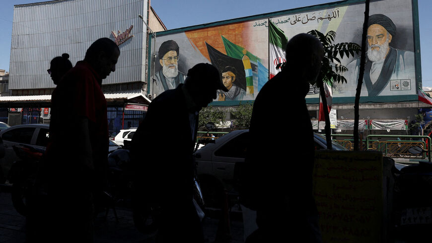 People walk past a mural depicting the late leader of the Islamic Revolution, Ayatollah Ruhollah Khomeini, and Iran's late Supreme Leader Ayatollah Ali Khamenei, in Tehran, Iran, May 25, 2026. Majid Asgaripour/WANA (West Asia News Agency) via REUTERS