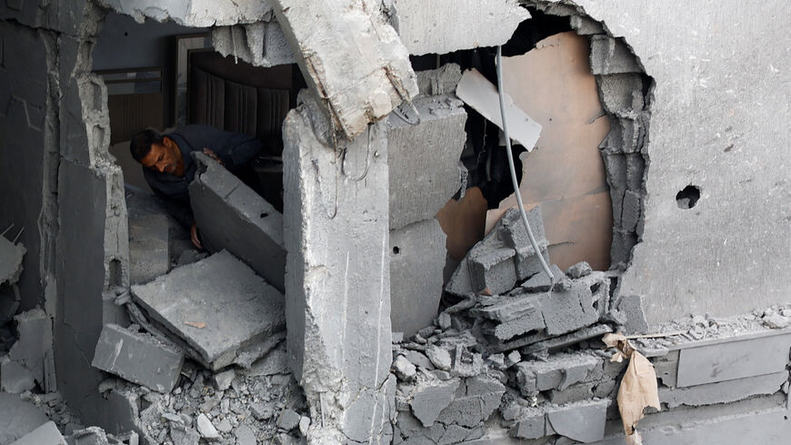 A Palestinian man inspects the site of an Israeli airstrike on a residential building on Tuesday, in Gaza City, May 27, 2026. REUTERS/Mahmoud Isaa