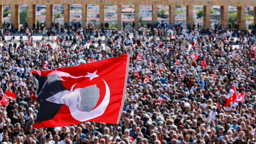 A person waves a flag of Turkey featuring a picture of modern Turkey’s founder Mustafa Kemal Ataturk as supporters of Ozgur Ozel, the ousted chairman of the main opposition Republican People’s Party (CHP), visit the mausoleum of Mustafa Kemal Ataturk in Ankara, Turkey, May 30, 2026. REUTERS/Efekan Akyuz