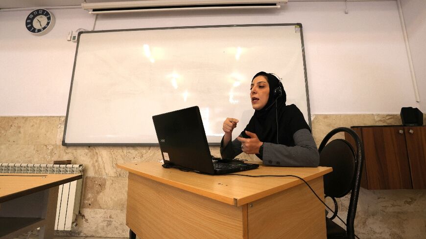 A teacher in Tehran holds her class online as hostilities keep lessons virtual