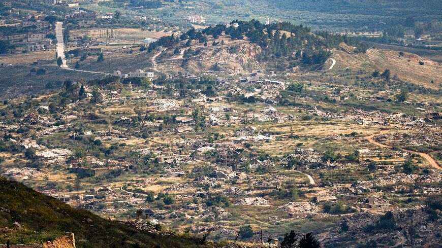 Destroyed buildings are pictured in the village of Kfarkila in southern Lebanon as seen from across the border in the Upper Galilee region of northern Israel on May 29