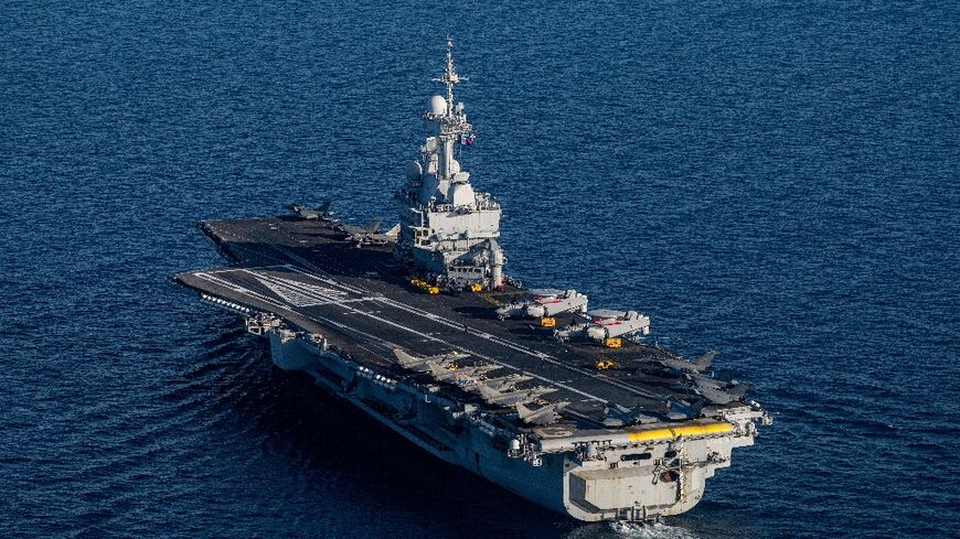 France's Charles de Gaulle aircraft carrier its escorts were transiting the Suez Canal, the defence ministry said
