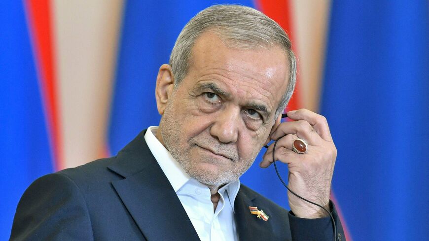 Iranian President Masoud Pezeshkian listens during a joint press conference alongside Armenia's prime minister in Yerevan on Aug. 19, 2025. 