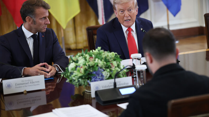 WASHINGTON, DC - AUGUST 18: U.S. President Donald Trump speaks during a meeting with Ukrainian President Volodymyr Zelensky (R), French President Emmanuel Macron (L), and European leaders at the White House on August 18, 2025 in Washington, DC. President Trump hosted President Zelensky at the White House for a bilateral meeting and an expanded meeting with European leaders to discuss a peace deal between Russia and Ukraine. (Photo by Win McNamee/Getty Images)