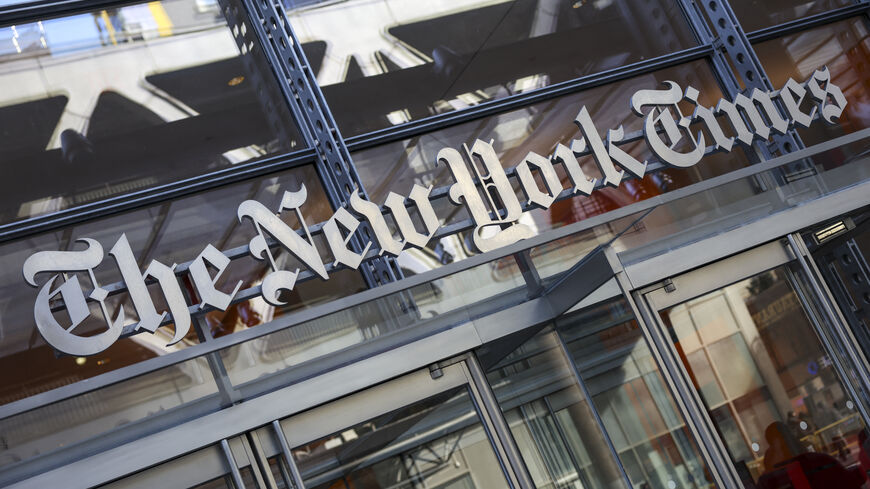 The New York Times logo is seen on the building's facade in New York City on January 22, 2026. US President Donald Trump announced today he will sue The New York Times over an unfavorable opinion poll and suggested that what he called "fake" surveys should criminalized. Trump lashed out after publication of a New York Times/Siena University poll finding only 40 percent approval for the 79-year-old Republican -- in line with multiple other polls showing declining support a year into his second term. (Photo b