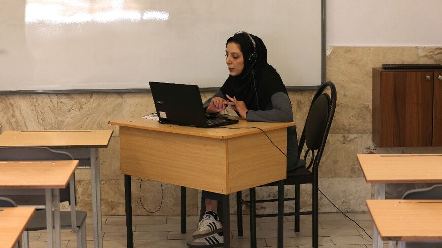 Teacher Faezeh Hasarakizad holds a class online via webcam