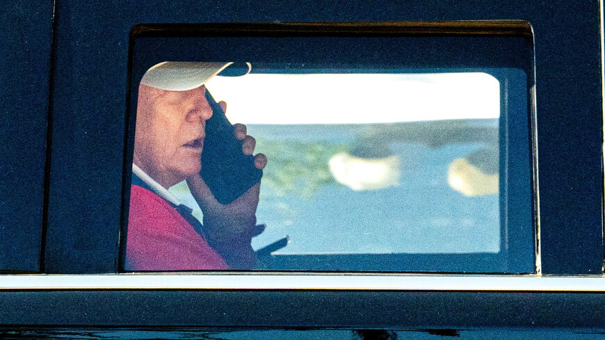 U.S. President Donald Trump talks on the phone as he departs the White House for Trump National Golf Club in Sterling, Virginia, U.S., May 31, 2026. REUTERS/Aaron Schwartz