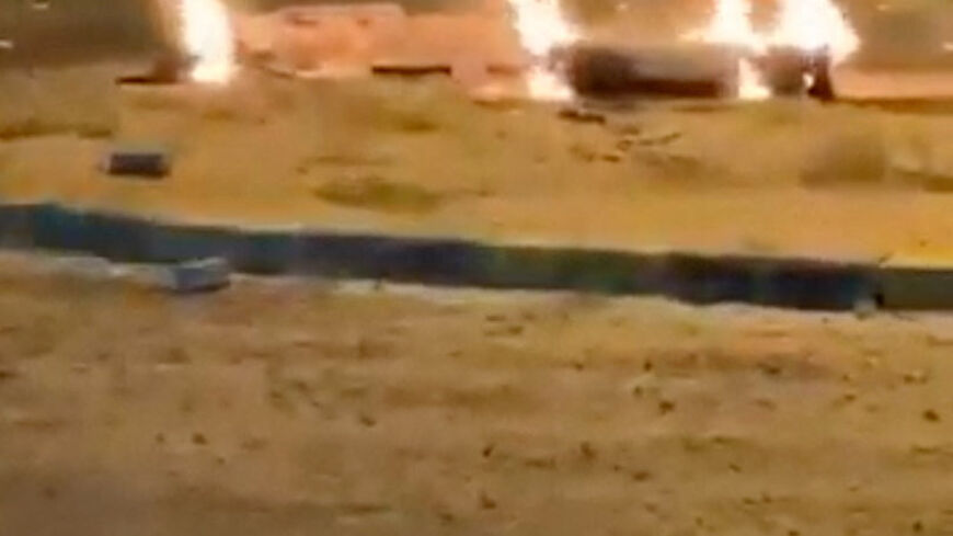 Debris burns on the ground in a parking lot following reports of missile and drone attacks, in Sabah Al Nasser, Kuwait June 3, 2026, in this screengrab obtained from a social media video . SOCIAL MEDIA/via REUTERS