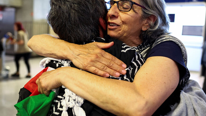 French activists from the Gaza-bound Global Sumud Flotilla, detained by Israeli forces after their vessels were intercepted in international waters in the Mediterranean, arrive at Charles de Gaulle Airport, in Roissy-en-France, near Paris, France May 22, 2026. REUTERS/Abdul Saboor