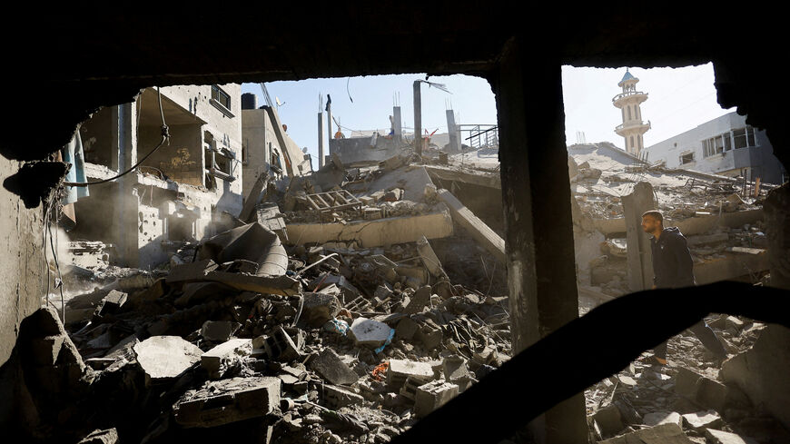 A Palestinian man inspects the site of an Israeli strike on a house whose residents were warned to evacuate before the attack, in Zawayda, central Gaza Strip June 5, 2026. REUTERS/Mahmoud Issa