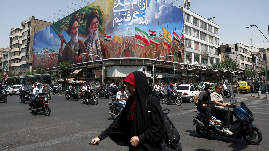 People ride past a billboard depicting the late leader of the Islamic Revolution, Ayatollah Ruhollah Khomeini, and the late Iran's Supreme Leader Ayatollah Ali Khamenei, on a street in Tehran, Iran June 6, 2026. Majid Asgaripour/WANA (West Asia News Agency) via REUTERS