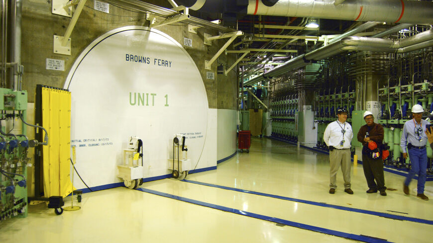 Nuclear officials stand near the entrance to a reactor at the Browns Ferry nuclear facility in Alabama, in this photo taken March 25, 2011. REUTERS/Matthew Bigg