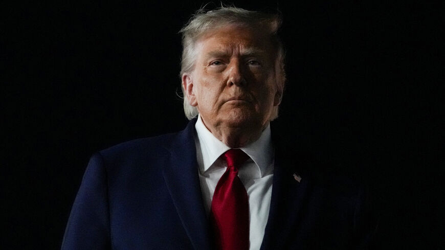 U.S. President Donald Trump looks on, as he returns after attending Game 3 of the NBA Finals, at John F. Kennedy International Airport in New York, U.S., June 8, 2026. REUTERS/Nathan Howard