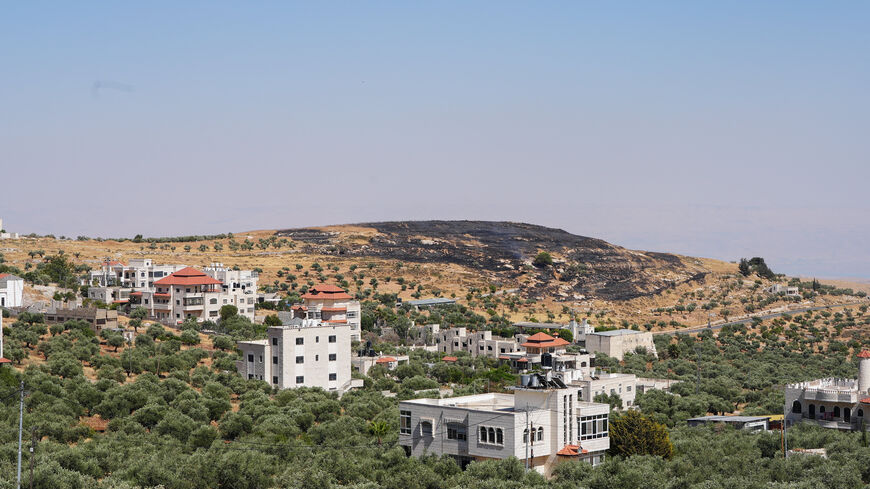A burned hilltop near the Christian Taybeh village in the Israeli-occupied West Bank, June 10, 2026. REUTERS/Ali Sawafta