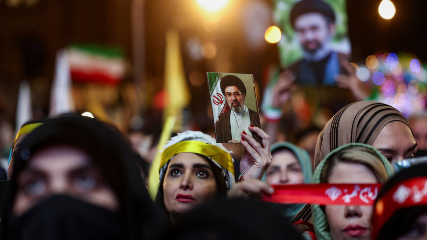 A woman holds an image of Iran's Supreme Leader, Mojtaba Khamenei, during an anti-U.S. and Israeli rally after Iran's missile attack on Israel, in Tehran, Iran, June 7, 2026. Majid Asgaripour/WANA (West Asia News Agency) via REUTERS