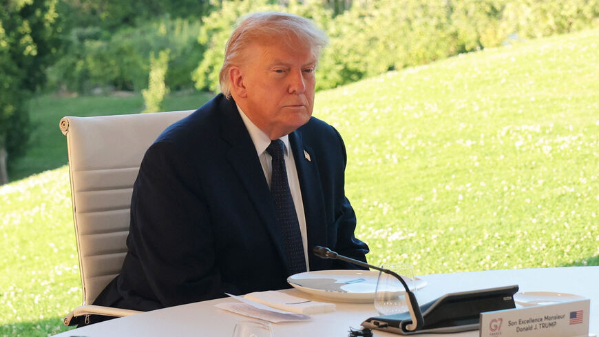 U.S. President Donald Trump participates in a G7 leaders’ working dinner during the G7 summit at Hotel Royal Evian on June 15, 2026, in Evian-les-Bains, France.     Anna Moneymaker/Pool via REUTERS