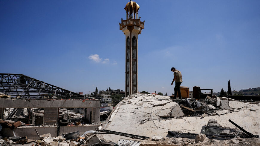 A man inspects the damage in Jibchit in the Nabatieh district, Lebanon, June 16, 2026, following a deal between the United States and Iran. REUTERS/Stringer